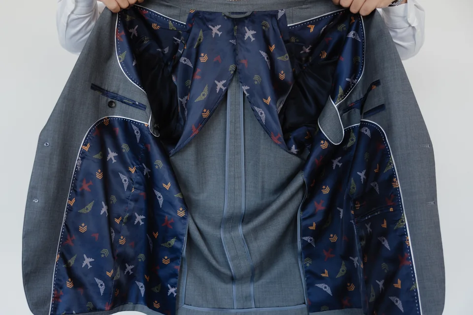 Custom suit jacket opened to show a colorful lining.
