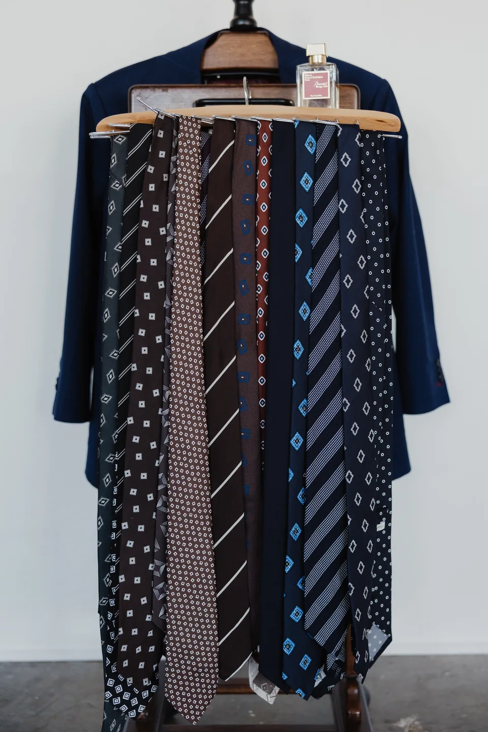 A photographed selection of ties on a suit hanger.